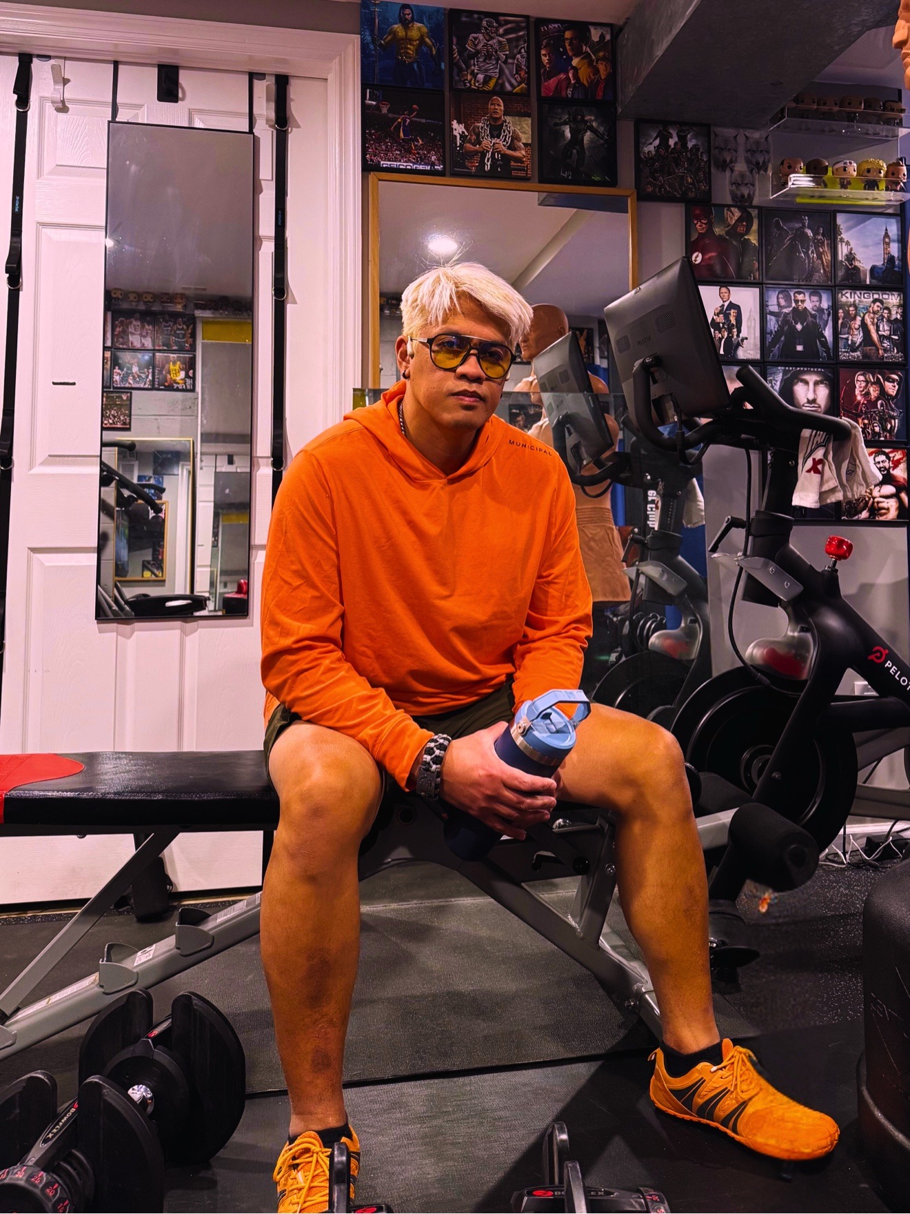 Coach Mike seated on a workout bench inside the Wolf's Den