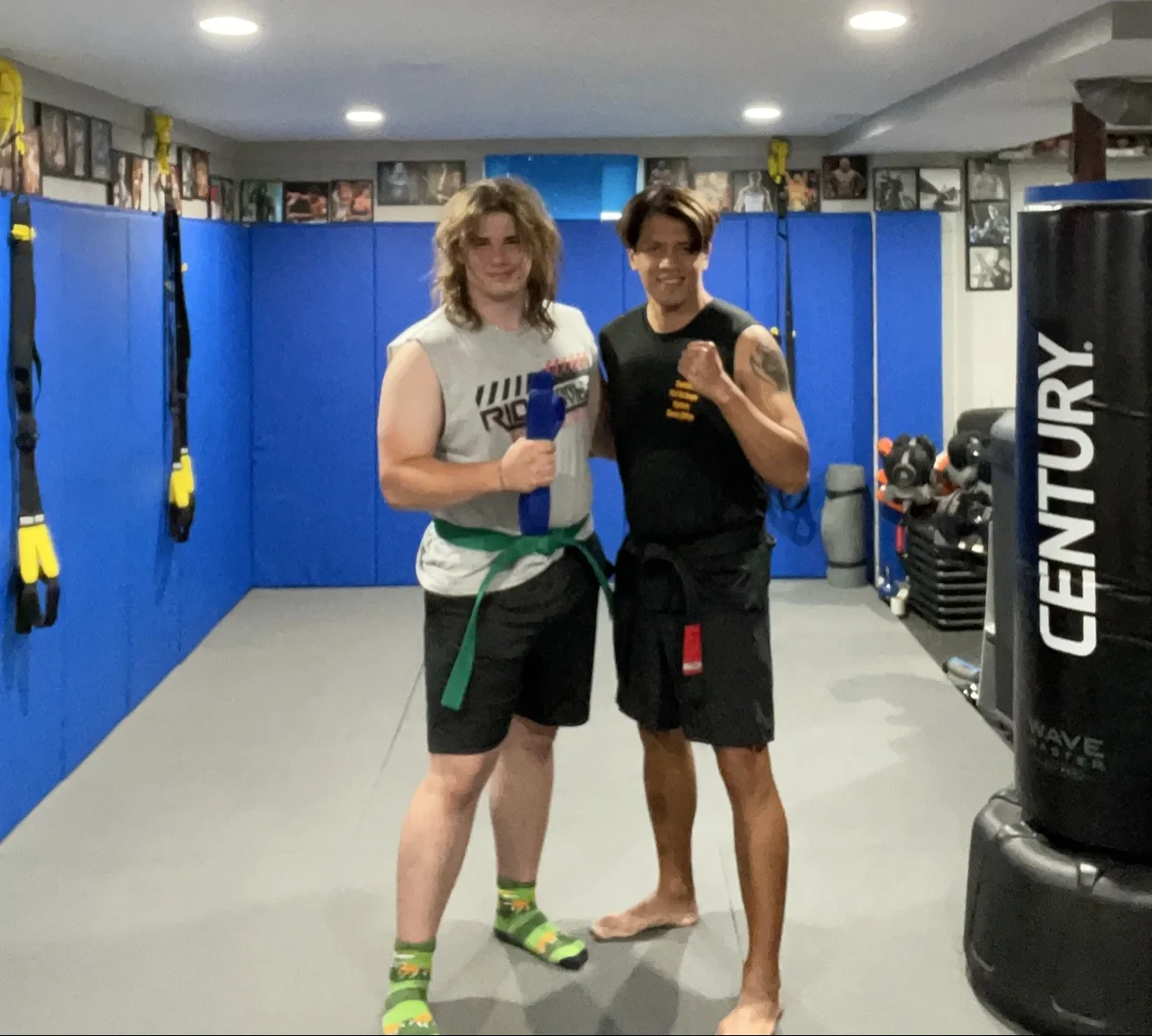 Coach Mike standing with an athlete after completing a coached workout