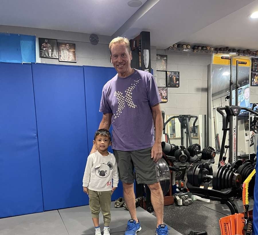A longtime client with a young student at Wolf's Den