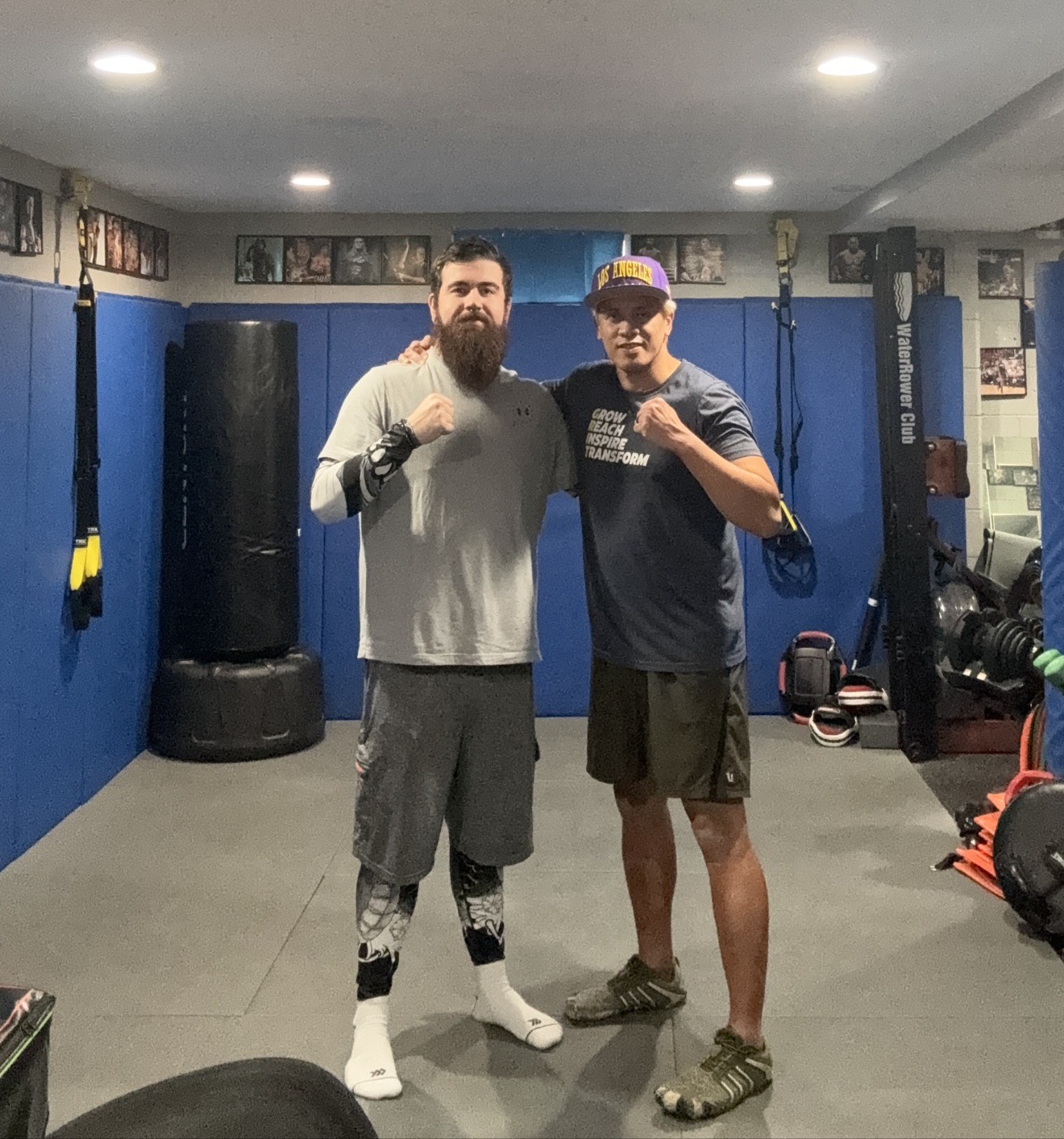 Coach Mike and a personal training client posing together at Wolf's Den